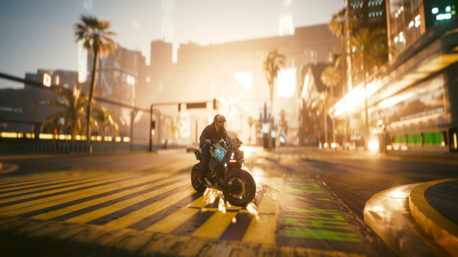 An officer riding a Brennan Apollo across a yellow-striped junction at sunset, palm trees backlit in gold