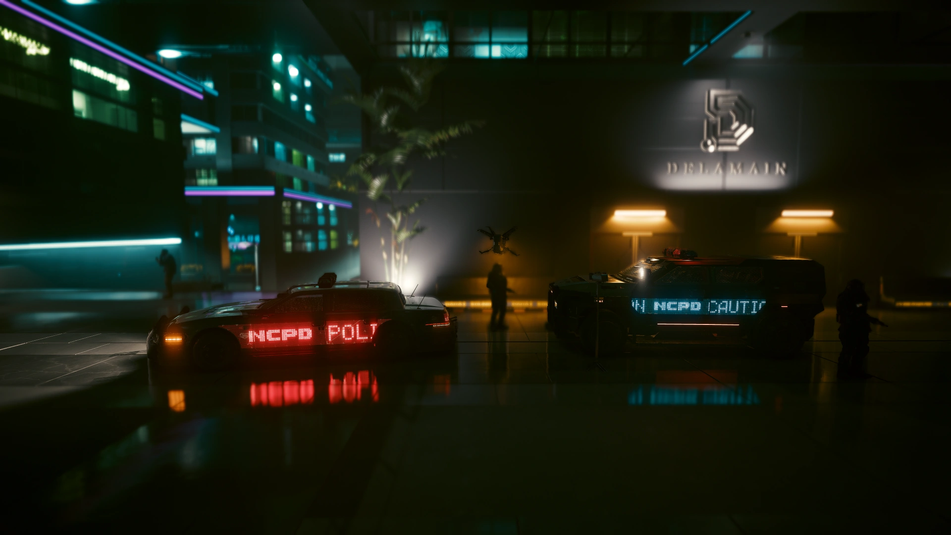 Two units parked outside the Delamain building at night, one side sign red and the other cyan, with silhouetted figures and a hovering drone between them