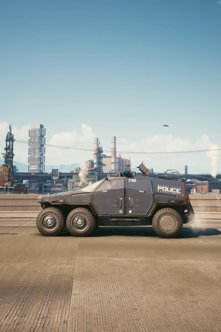 A six-wheeled Militech Hellhound, unit 712, on an elevated road in daylight, smokestacks and an industrial skyline behind