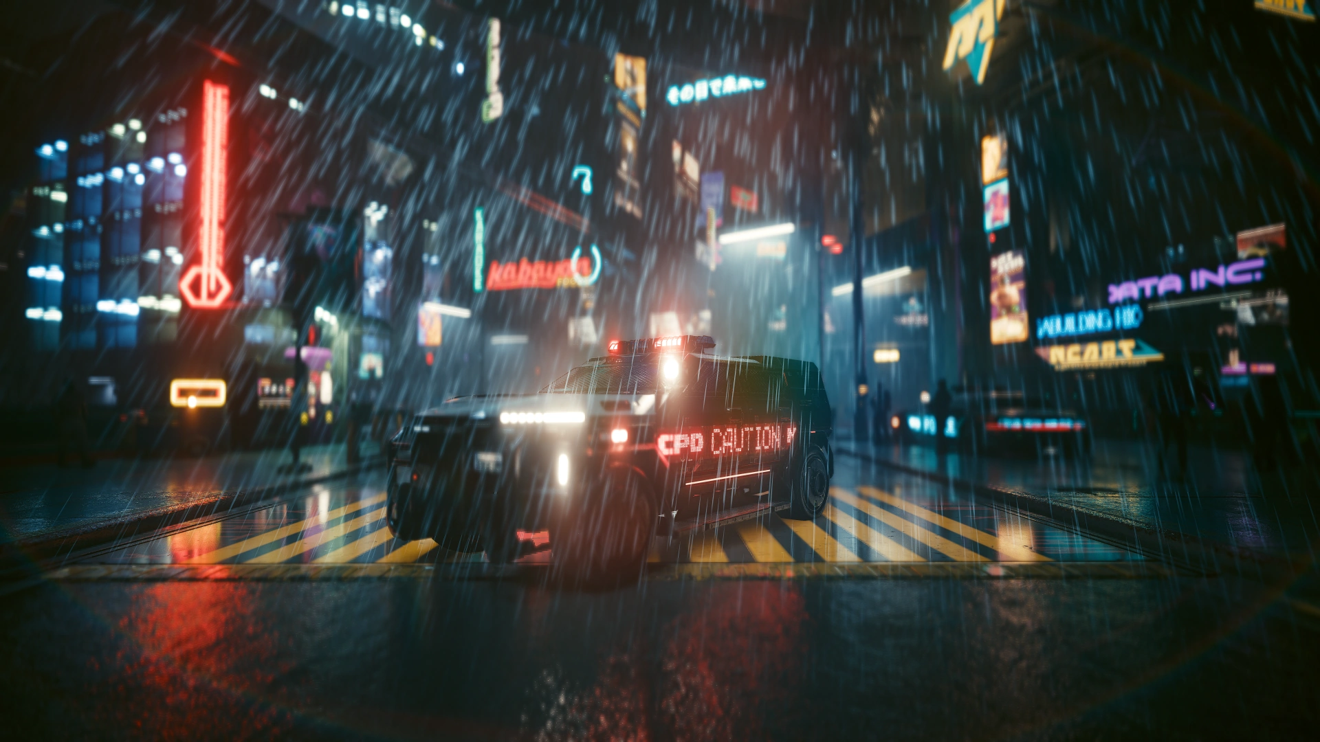 An armoured NCPD unit, roof lights on and CAUTION lit red along its side, stopped on a striped crossing in a downpour, a second unit blurred in the background